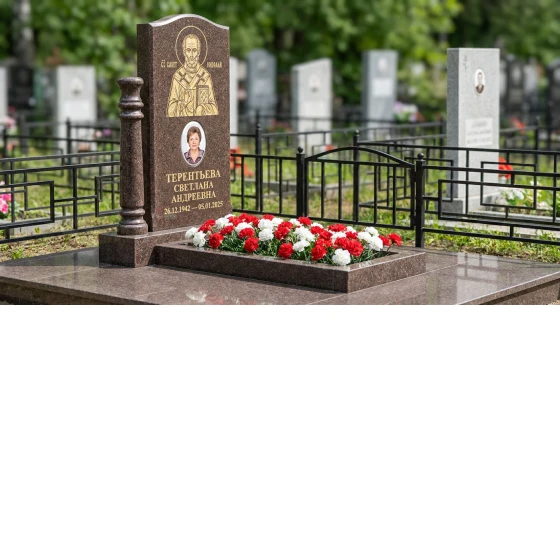 Гранитный памятник фигурный с гравировкой голубя и цветником