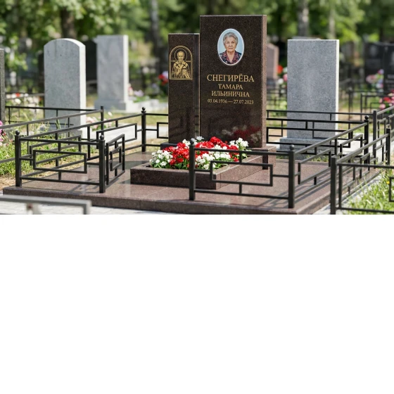 Гранитный памятник в виде книги с оградой